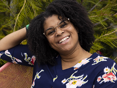 smiling woman wearing glasses