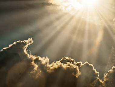 bright burst of sunlight over clouds