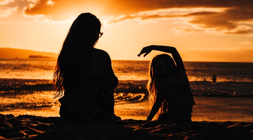 mother and daughter at the beach