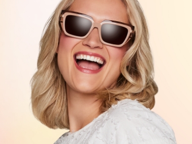 woman in glasses smiling